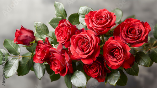 Bouquet of beautiful red roses on grey background  closeup