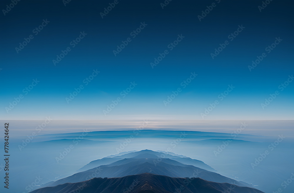 a mountain range with blue sky