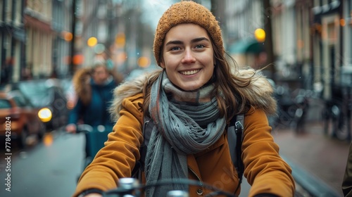 Woman Riding Bike Down Street © olegganko