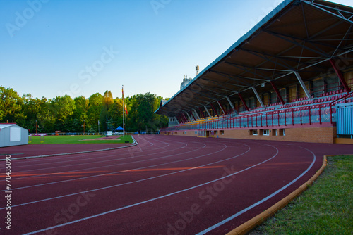 Sports stadium, athletics treadmill for runners at an outdoor stadium, stands for fans, Poland, Bialystok