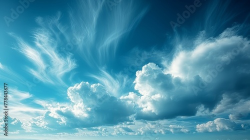 a blue sky filled with white clouds and a lone boat floating in the middle of a large body of water. photo