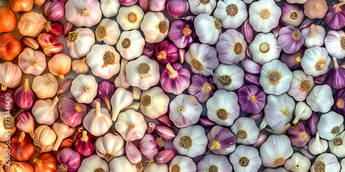 The background is a colorful combination of garlic bulbs of different sizes