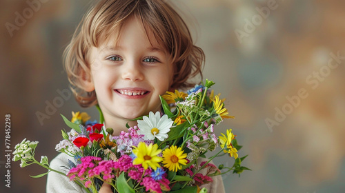 Happy, smiling kid with bunch of colorful flowers for mothers day or birthday celebration. Horizontal banner or background