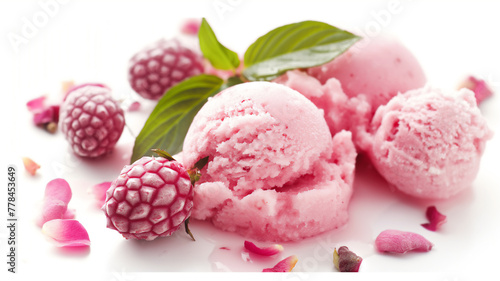Scoops of raspberry sorbet with whole berries and scattered petals on a white surface.