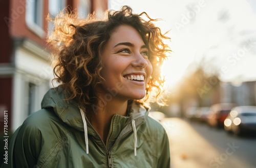smiling young woman outdoors at sunset