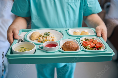 Canvas Print Nurse is serving dietary food in inpatient facility ward