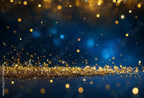A luxurious abstract background awash in deep navy blue. Golden, twinkling particles dance across the scene, some with a soft blue glow. Delicate gold foil