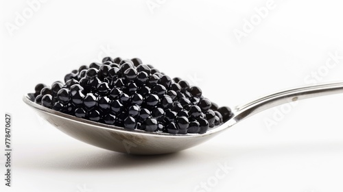 Indulge in a Rich Delicacy of Black Caviar - Closeup of Caviar in Spoon on White Background, Perfect for Celebrations and Breakfast Appetence