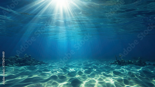 Sun shining light in blue clearly deep water, sunbeams illuminate the blue underwater sea scene, background 
