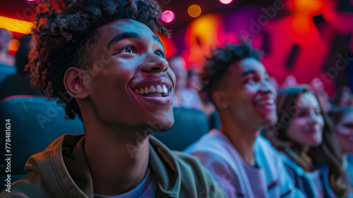 Young adults enjoying a movie in a theater.