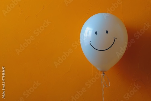 White Balloon With Smiley Face Drawn On It photo