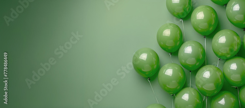 A Bunch of Green Balloons Floating in the Air