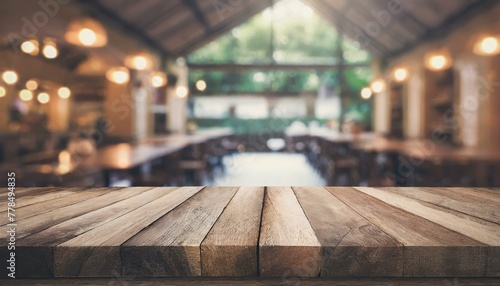 Echoes of the Past: Empty Wooden Table in a Blurry Restaurant