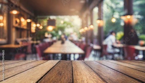 Wallpaper Mural Vintage Charm: Blurred Restaurant Interior with Empty Wooden Table Torontodigital.ca
