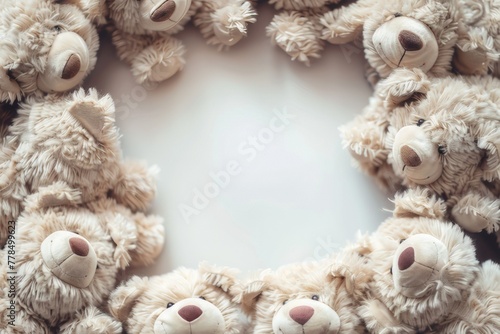 A cute frame with a cuddly teddy bear in each corner.