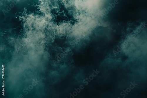 Misty black smoke or fog on dark background, eerie atmospheric overlay effect