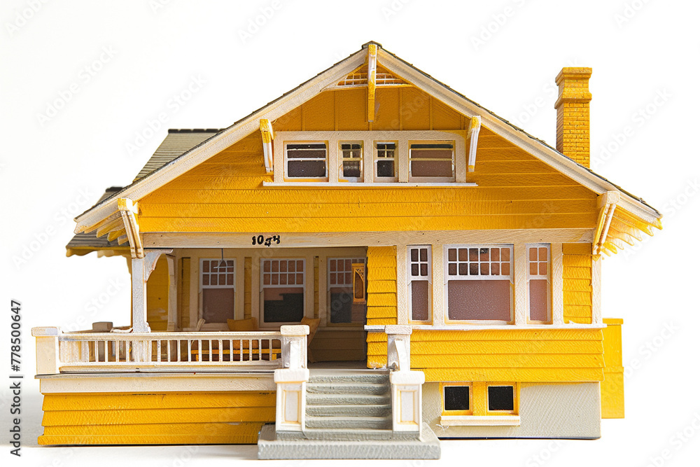 A sunny yellow craftsman-style miniature house, its cheerful demeanor brightening the white space with its unique charm.