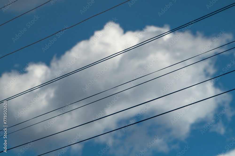Electric wires and white cloud behind Electric wires and white cloud behind