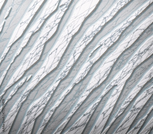 A close-up image of a white marble wall with visible cracks and scratches.