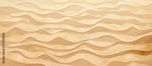 A detailed shot of a sandy beach showcasing the brown and beige color palette of the flooring with waves gently washing over the shore photo