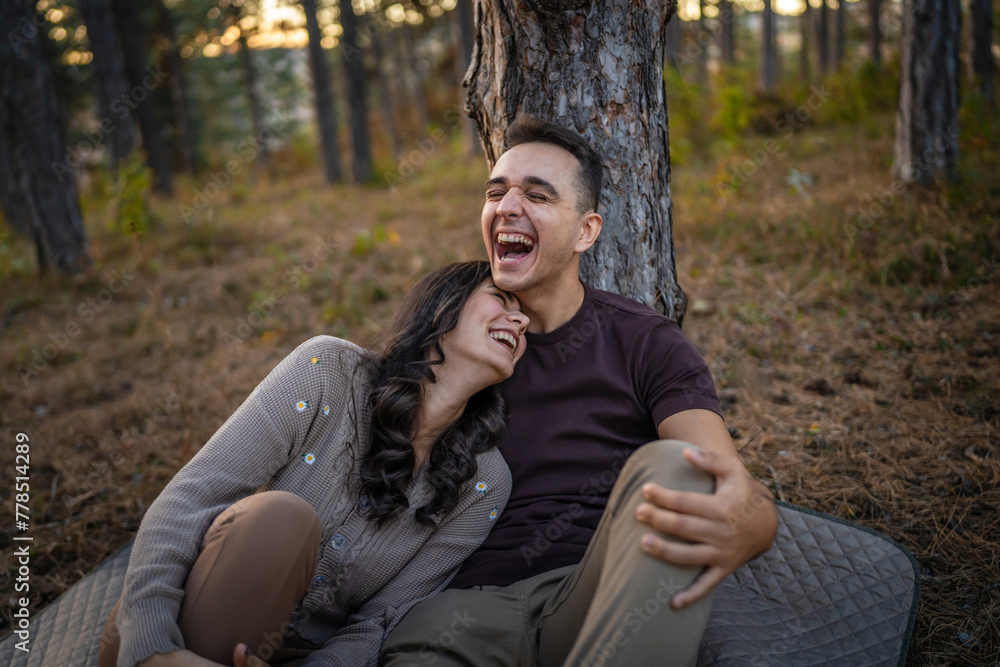 Man and woman young adult couple in love sit in nature Man and woman young adult couple in love sit in nature