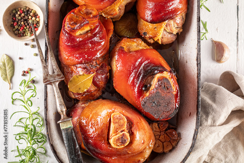 Photography Aromatic and fat pork knuckle baked in casserole.