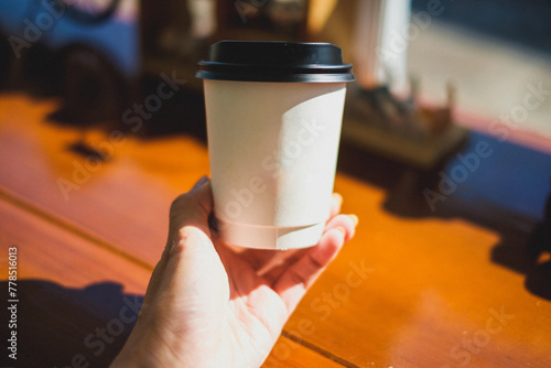 A person enjoys a steaming cup of coffee at a cozy cafe table, surrounded by a variety of delicious beverages and breakfast options