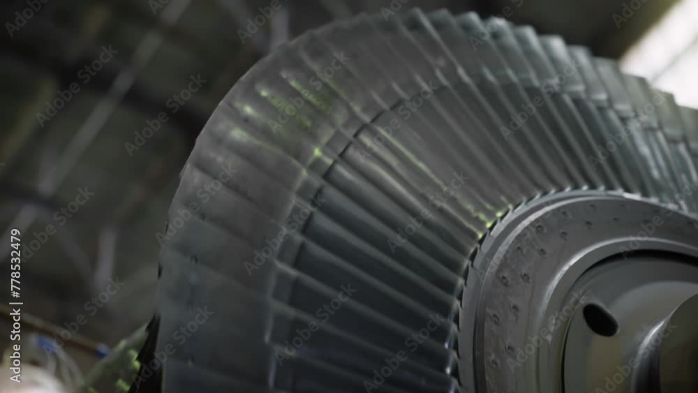 Close Up Of An Industrial Rotating Blades Of Heavy Turbine Engine Machinery. Automated Rotating Metal Turbine Blades. Rotary Electric Power Turbine Blades At Modern Heavy Industry Factory Close Up Of An Industrial Rotating Blades Of Heavy Turbine Engine Machinery. Automated Rotating Metal Turbine Blades. Rotary Electric Power Turbine Blades At Modern Heavy Industry Factory