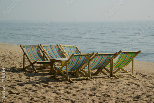 Beach deck chairs in the morning at Cha-am Beach. © topten22photo