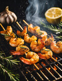 Three skewers of shrimp sear on a charcoal grill alongside lemons and garlic cloves - delicious prawns make for a healthy grilled meal with lemon, garlic, rosemary and olive oil. 