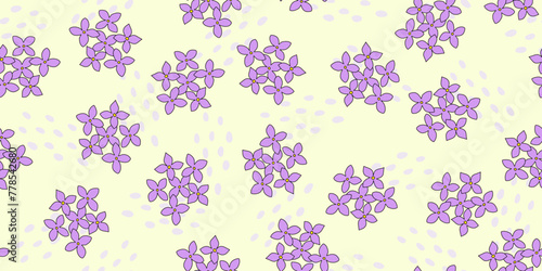 Seamless pattern with lilac, hydrangea or bluet flowers and abstract drops on yellow, vector