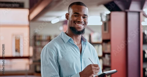 Face, education or black man in a library writing with smile for knowledge, notes or development for learning. Scholarship, portrait or happy college student studying information with journal diary photo