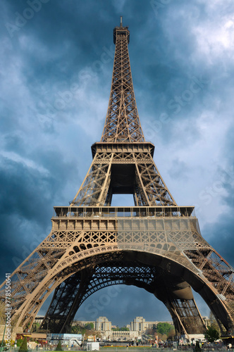 The Eiffel tower in Paris  France  against dramatic skies.