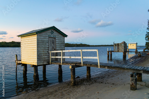 Vintage wooden Maroochy River boathouse and jetty on the Sunshine Coast at dawn