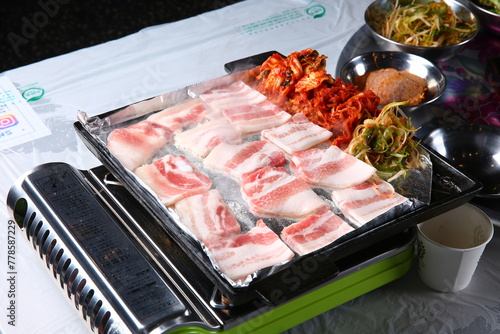 Pork belly that is cooked on a Korean-style grill