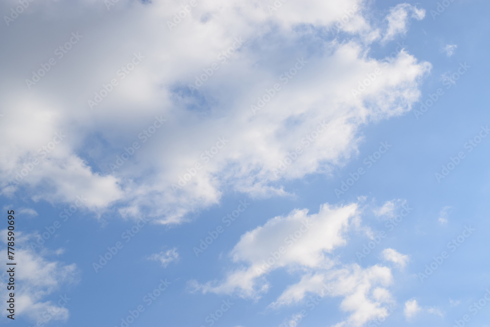 Peaceful blue sky with light clouds