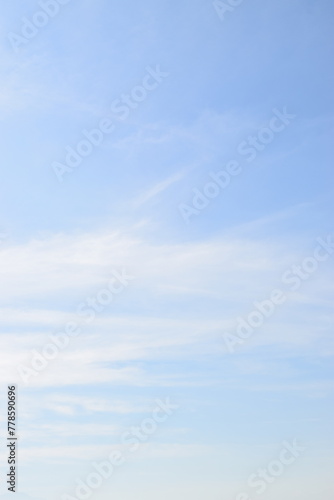 Peaceful blue sky with light clouds