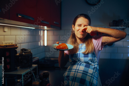 Pregnant Woman Disliking the Smell of Meat Cooking it. Mother to be suffering from food aversions during pregnancy 
 photo