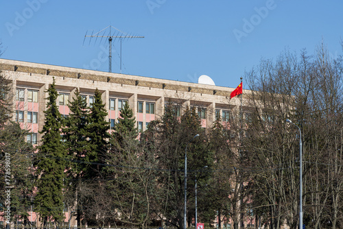 View of the building of the Embassy of the People's Republic of China. Moscow, Russia. Near the building there is a flagpole with the red flag of China. photo