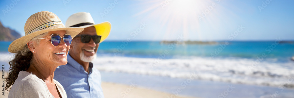 Retired couple relaxing on sunny tropical beach Retired couple relaxing on sunny tropical beach