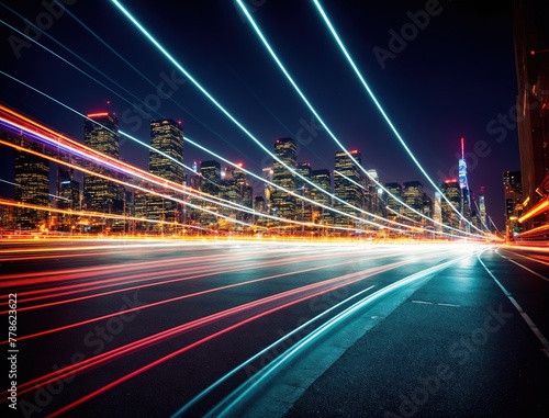 A cityscape at night with bright, blurred lights in the background.