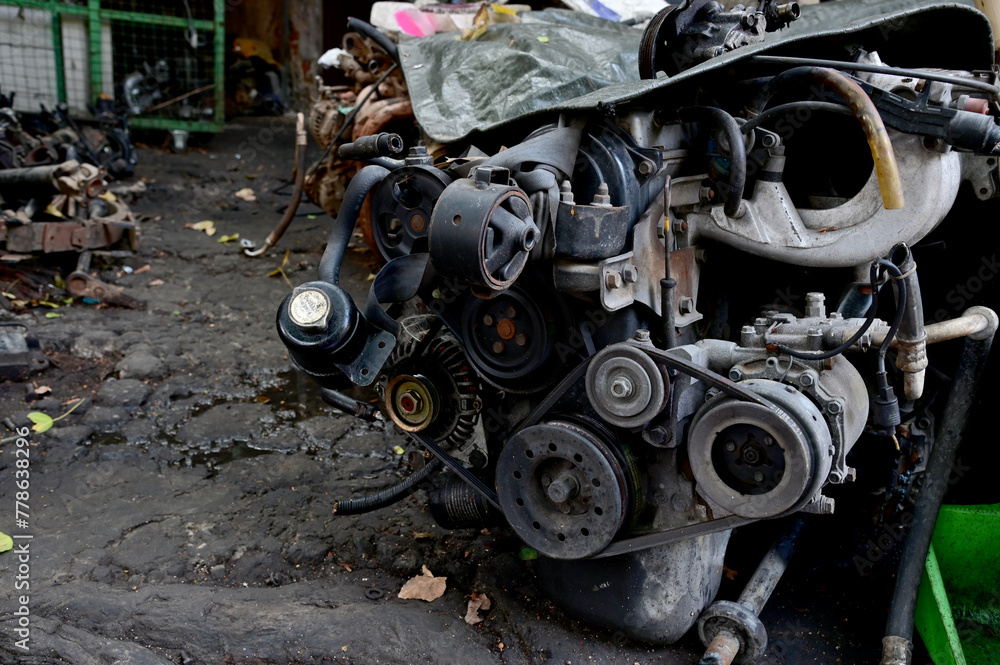 Bangkok, Thailand - April 07, 2024: Lots of scrap metal parts of old car parts, old machine parts for recycling and sold to tourists passing in old alley Talad Noi, Thailand. Bangkok, Thailand - April 07, 2024: Lots of scrap metal parts of old car parts, old machine parts for recycling and sold to tourists passing in old alley Talad Noi, Thailand.