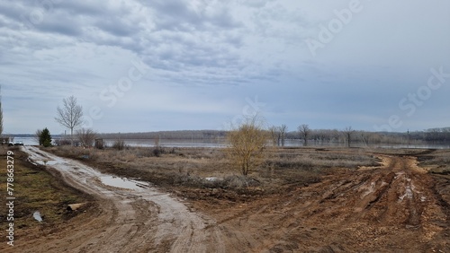 flooding of a forest when a river overflows its banks because a dam breaks