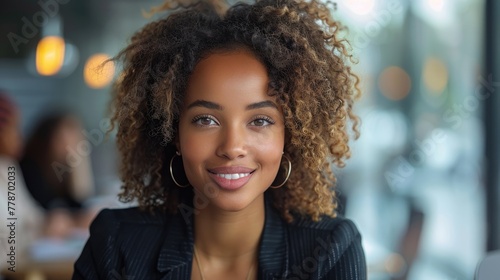African American Woman smiling at the camera during a meeting in a business office. Mature and professional business woman leading a corporate team towards success. Generative AI © Vilaysack