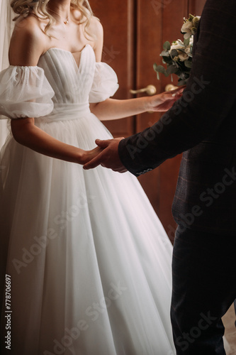 The image features a man and woman holding hands 6987.