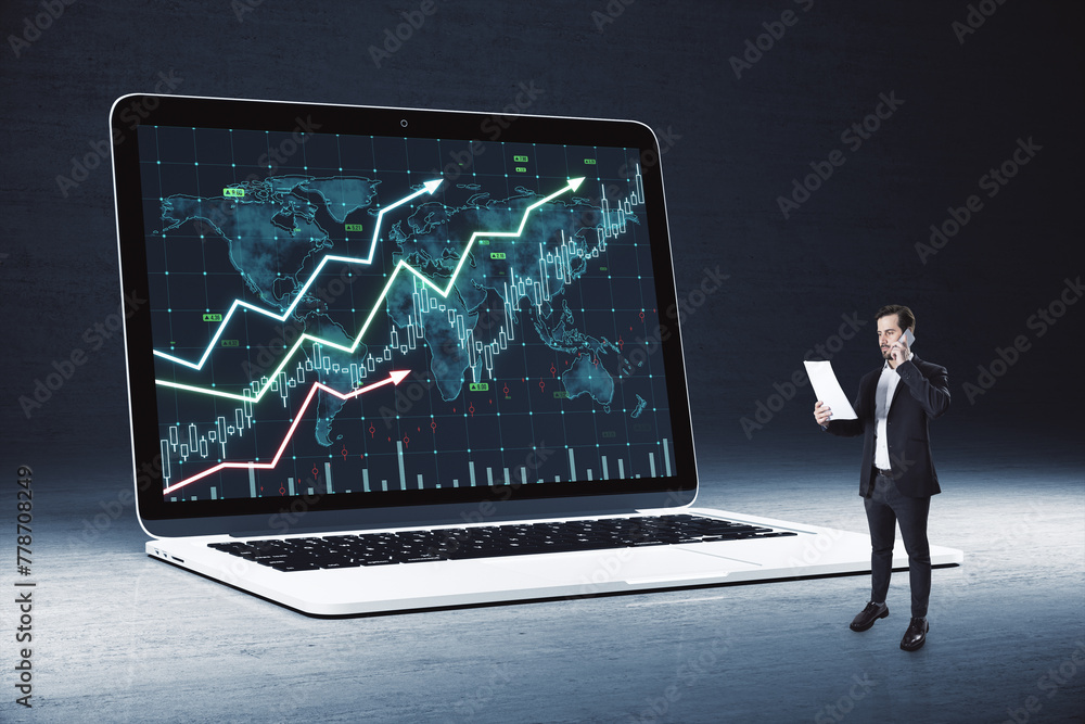 Young european man looking at huge laptop with forex chart on screen. Dark background. Trade, finance and money concept. Young european man looking at huge laptop with forex chart on screen. Dark background. Trade, finance and money concept.