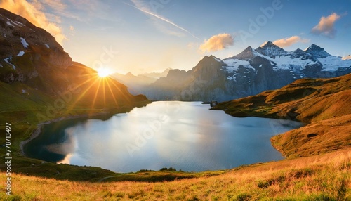 fantastic evening panorama of bachalp lake bachalpsee switzerland picturesque autumn sunset in swiss alps grindelwald bernese oberland europe beauty of nature concept background photo