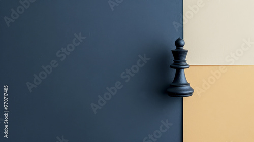Black chess pawn on a split background of blue and beige.