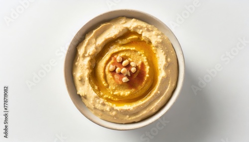 spicy hummus in a bowl top view isolated on white background