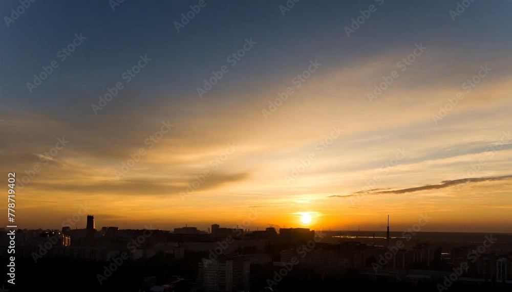 the beautiful color of the evening sky the view of the city s shadows in the evening the yellow sky when dusk comes